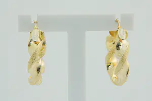 80- paar 18 Krt geel gouden holle & "gedraaide" oorringen kopen? Bied vanaf 200!