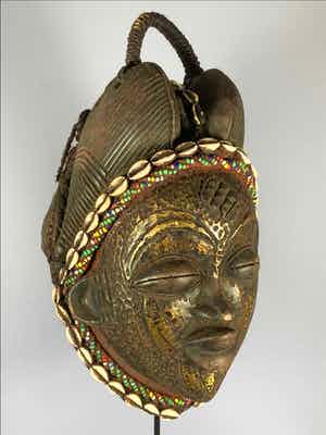 Pumu - Tribal used Old African female Bronze mask from the Punu with Cap - Gabon. verkocht voor € 125!