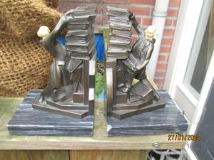 Brons (Onbekend) - Uniek brons boekensteun met aardewerk hoofdje 2 stuks kopen? Bied vanaf 75!