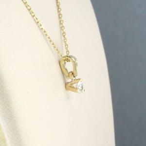 14k collier met solitair hanger bezet met briljant geslepen diamant 0,10ct kopen? Bied vanaf 160!