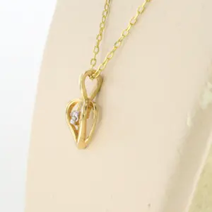 14k gouden collier met hanger bezet met briljant geslepen diamant kopen? Bied vanaf 110!