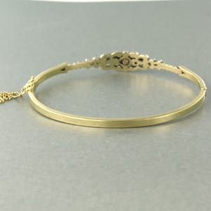 14k gouden scharnierarmband met een zilveren kop bezet met roos diamanten kopen? Bied vanaf 500!