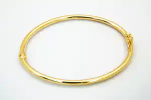 Gladde 14krt geel-gouden ovalen unisex "slaven" armband verkocht voor € 130!