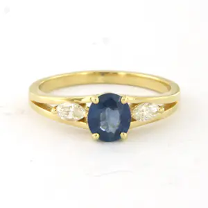Acheter18k gouden ring met saffier tot. 0.88ct en marquise geslepen diamant tot.0.20ct? Enchérissez de 685!
