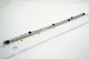 44 -  Lang (60cm) Surinaams 1e geh. Zilveren jasseron collier met  blauwe kralen kopen? Bied vanaf 25!