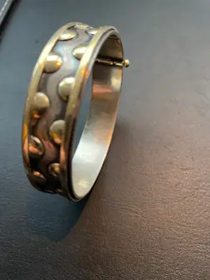 AcheterJan Noyons - Armband goud met zilver? Enchérissez de 1500!