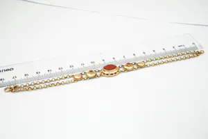 Elegante 14 karaats geel-gouden dames armband gezet met bloedkoraal kopen? Bied vanaf 240!
