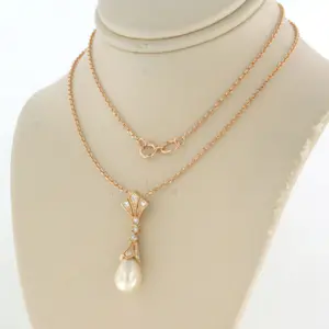 14k gouden collier en hanger met parel en single cut geslepen diamant 0.20ct kopen? Bied vanaf 440!