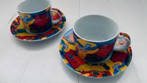 Corneille - set van 2 kop en schotels (porselein) in kleurrijk diermotief kopen? Bied vanaf 40!