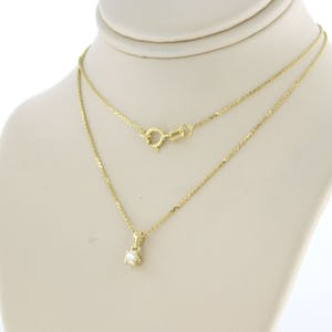 14k gouden collier met hanger bezet met briljant geslepen diamant tot. 0,11ct kopen? Bied vanaf 1!