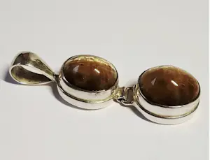 Nieuwe handgemaakte  langwerpige zilveren hanger met een mooie tijgerogen kopen? Bied vanaf 60!